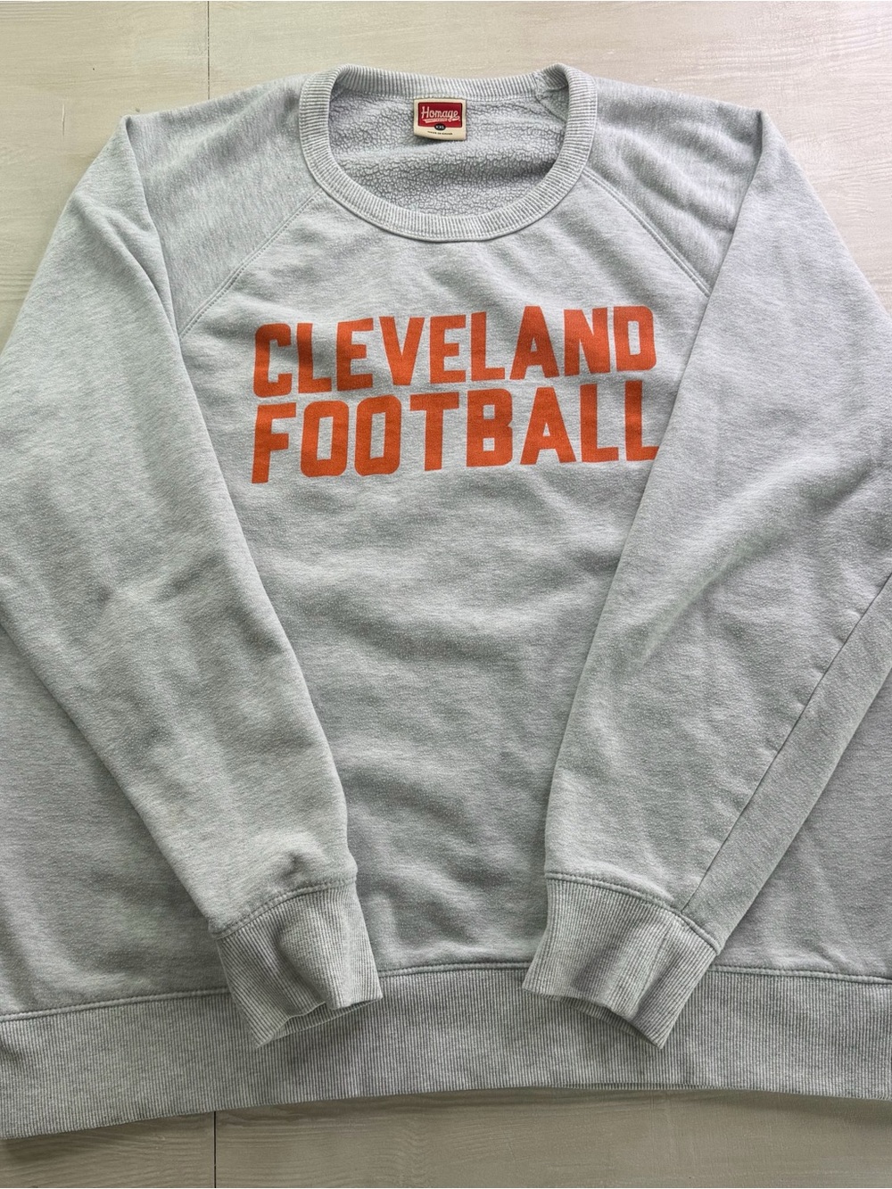 HOMAGE Gray Crewneck Sweatshirt with Orange Cleveland Football Text